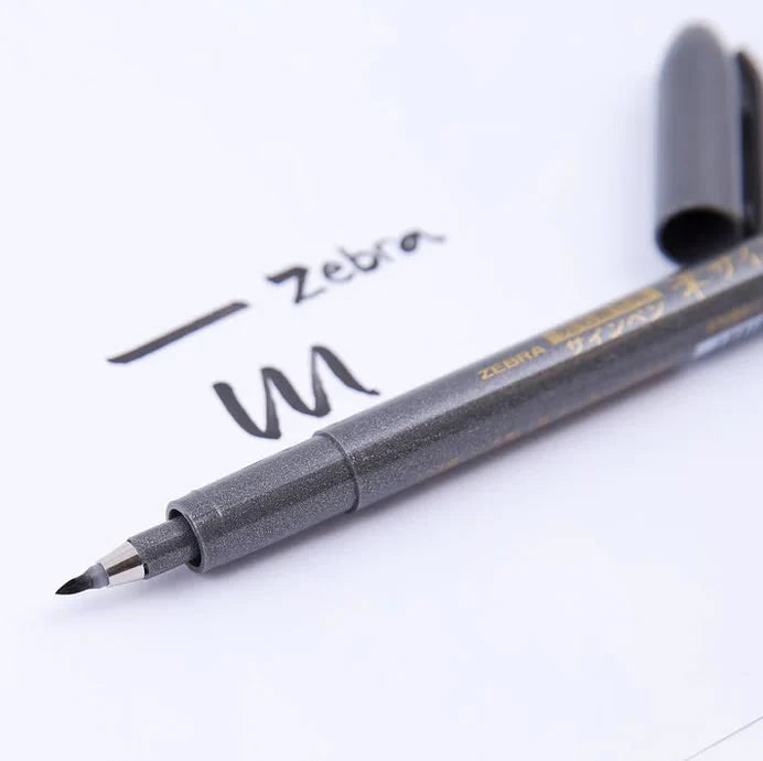 Durable hard synthetic brush tip of Zebra Fude pen, perfect for fine line control and professional manga ink work.